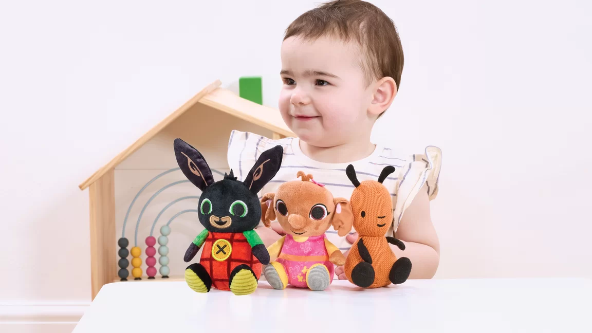 Child with Bing, Sula and Flop plush