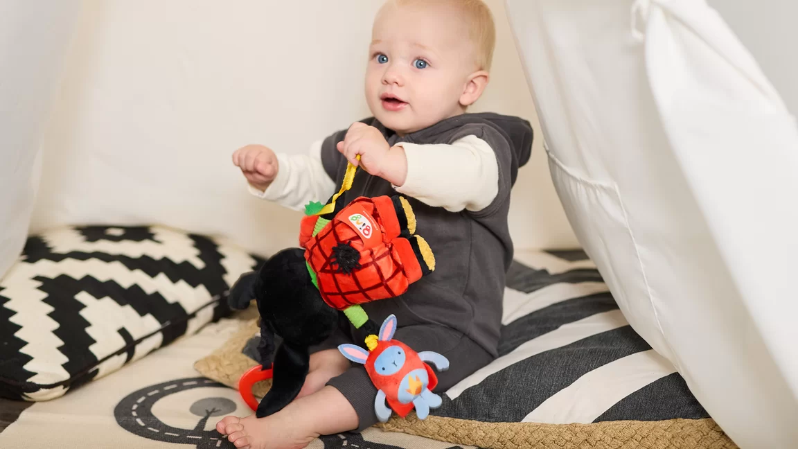 Baby playing with Bing and Hoppity Voosh plush