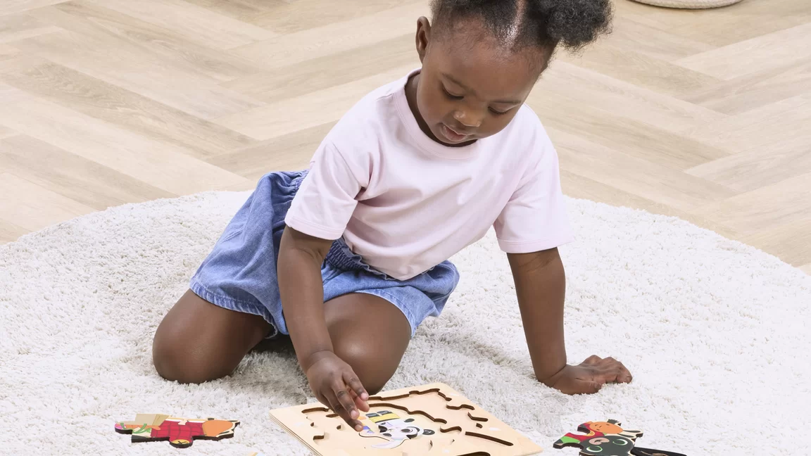 Child playing with puzzle